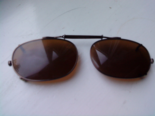 Clip-on sunglasses left at the Glass Vase Concert on 23rd May 2010