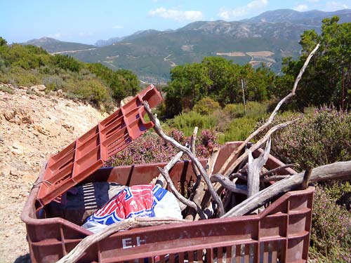 A box of twigs, rocks, and goat deposits in Paleochora, Crete