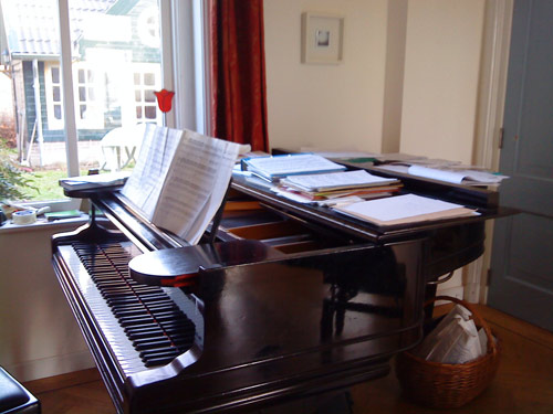 My piano with scores divided into piles: for French horn, cello, guitar, solo My piano with scores divided into piles: for French horn, cello, guitar, solo