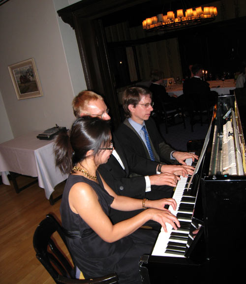 Decision scientists playing 6 hand piano music at the Helsinki Hilton
