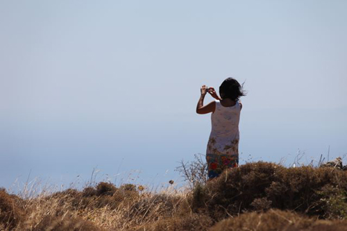 Anne trying to take a picture of the panoramic view above Paleochora, Crete Anne trying to take a picture of the panoramic view above Paleochora, Crete